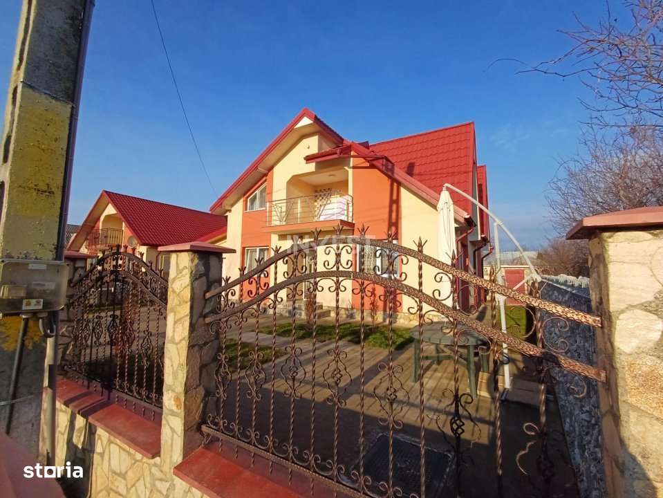 CASA CU 4 CAMERE , BECI SI GARAJ , 825MP TEREN , VOINESTI - Imagine principală: 4/19