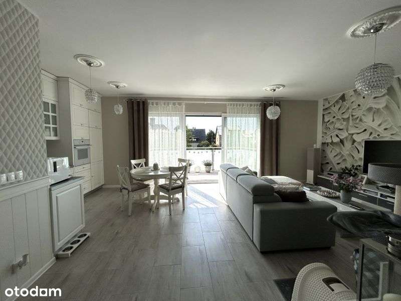 Dwupoziomowy apartament z dużym tarasem i miejscem postojowym.-1