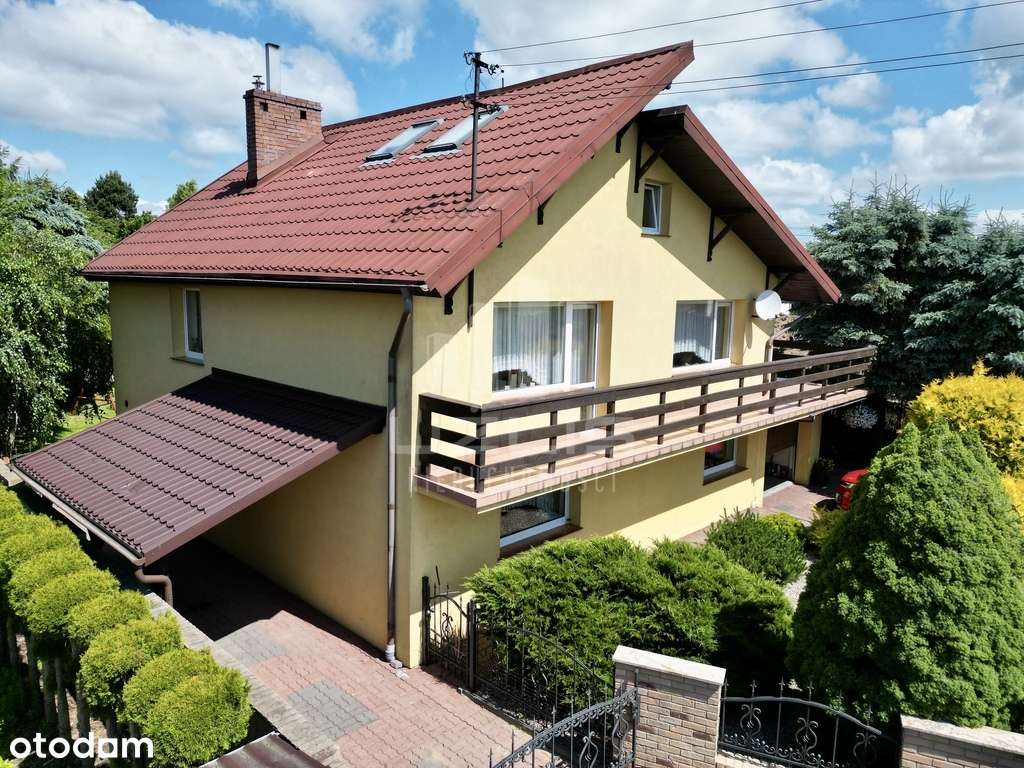 Solidny dom z garażem i budynkiem gospodarczym