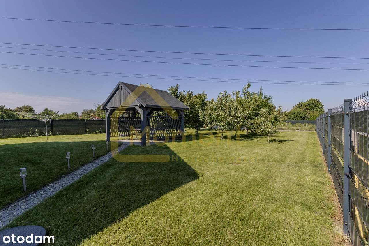 Ekonomiczny dom z garażem i pięknym ogrodem-2