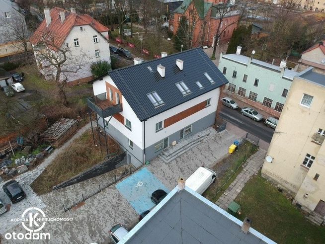 Nowy budynek z własnym parkingiem w centrum miasta