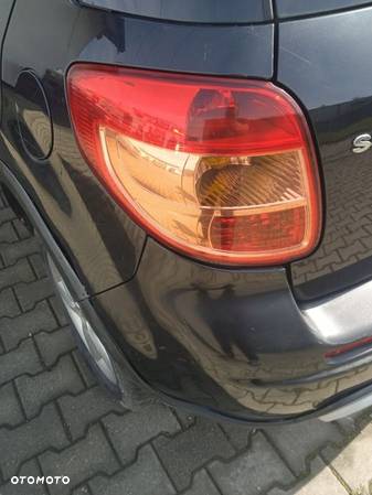 SUZUKI SX4 Lampa lewa tył tylna - 1