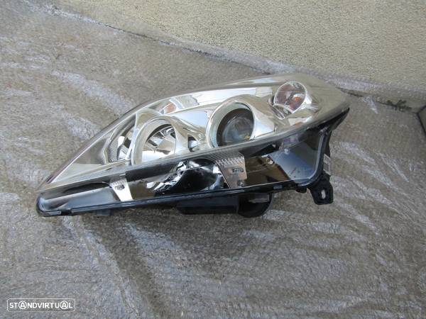 Farol optica esquerda Opel Vectra C ano 2006 ref. 13251939 - 2