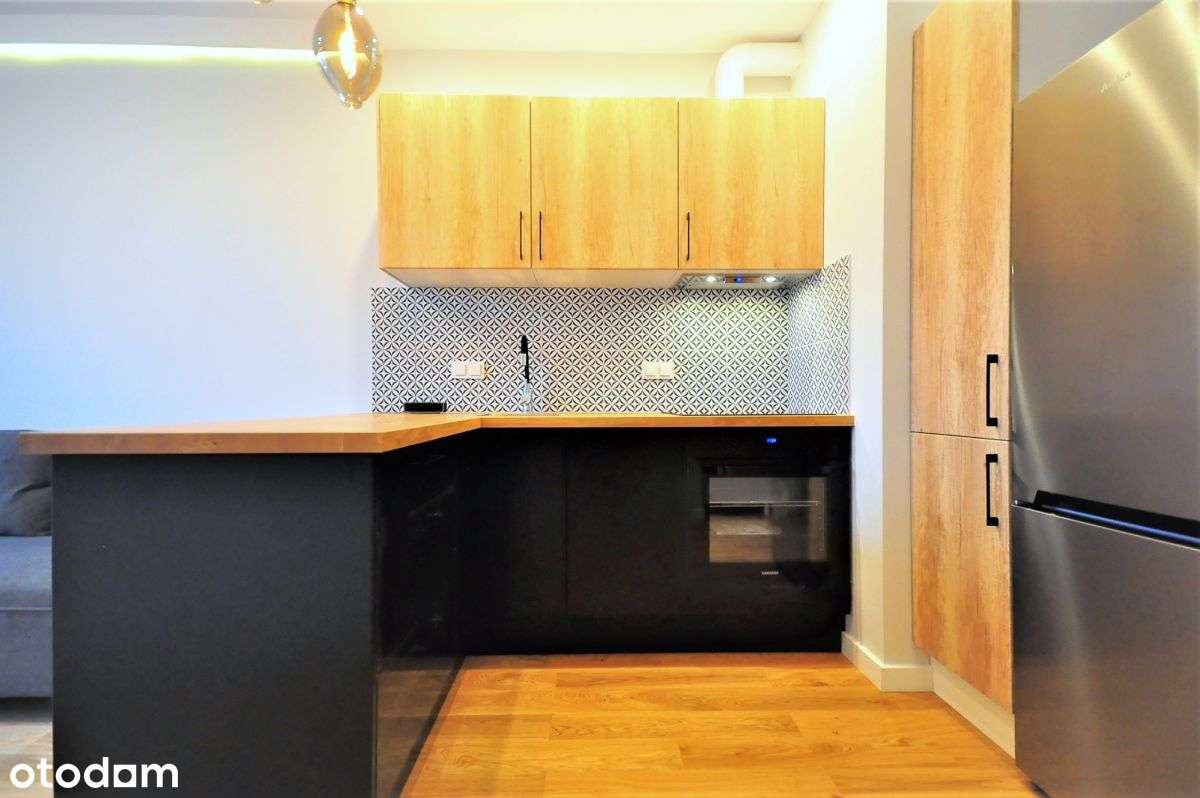 Kawalerka z sypialnią, balkonem i garażem.-2