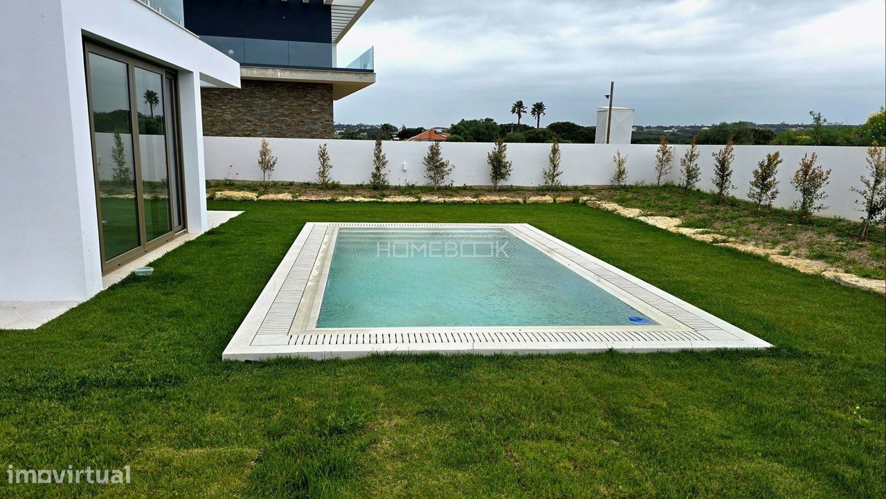 Moradia comtemporânea com vista para a Serra de Sintra e piscina - Grande imagem: 1/25