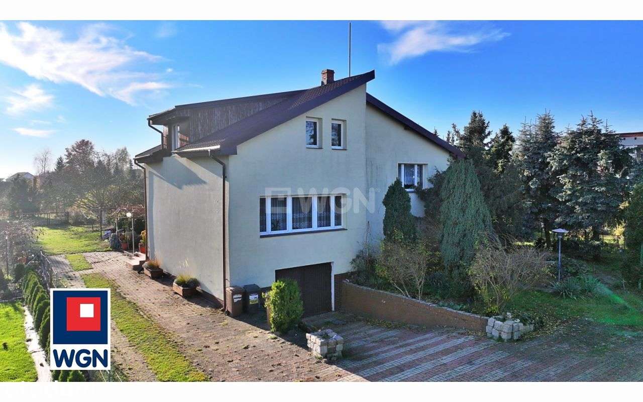 Dom z dużą działką + wynajęty lokal usługowy i pac-2