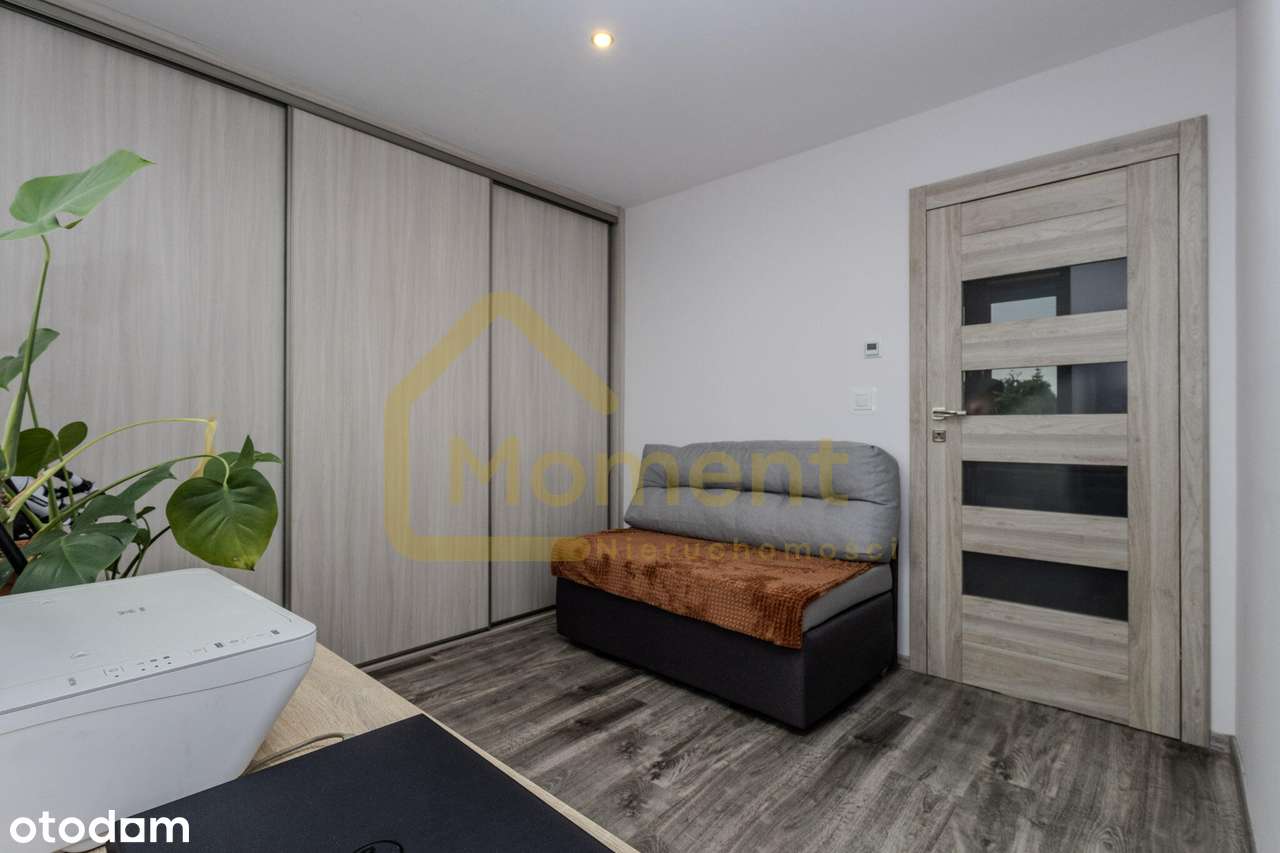 Ekonomiczny dom z garażem i pięknym ogrodem-15