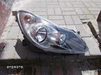 LAMPA PRZEDNIA PRAWA OPEL CORSA D 06-11 CIEMNA - 1