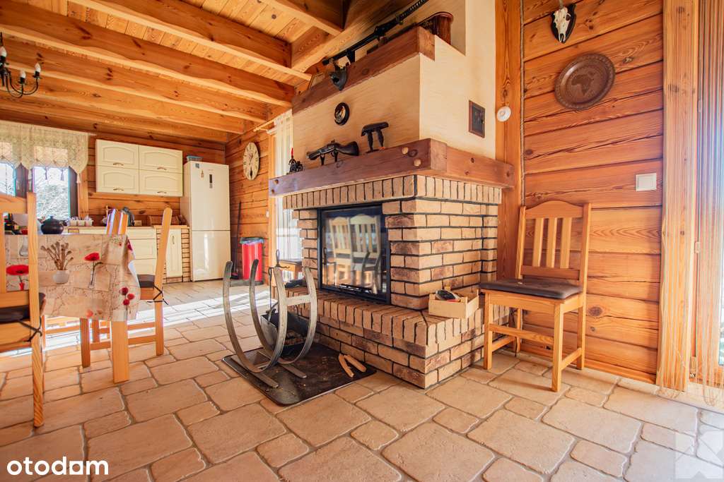 Dom z pełnego bala z zarybionym stawem-11