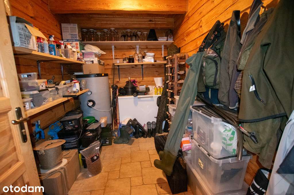 Dom z pełnego bala z zarybionym stawem-18