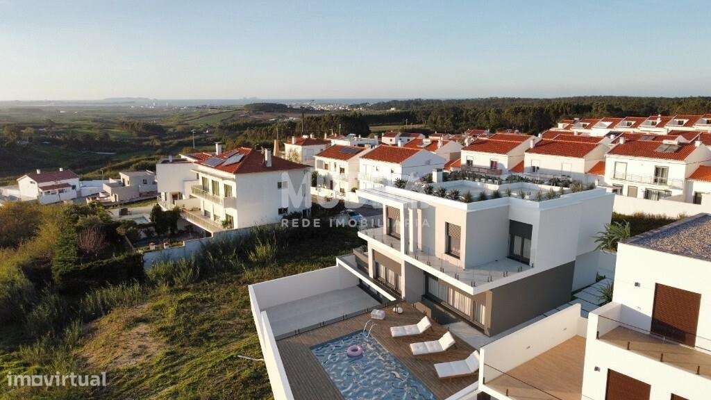 Moradia isolada de design contemporâneo nos Casais Mestre Mendo - Grande imagem: 5/19