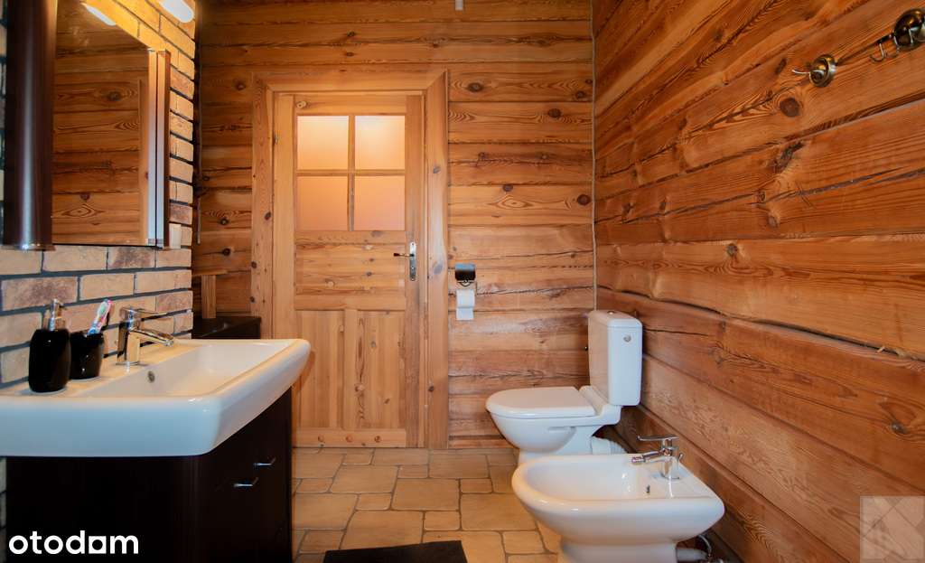 Dom z pełnego bala z zarybionym stawem-17