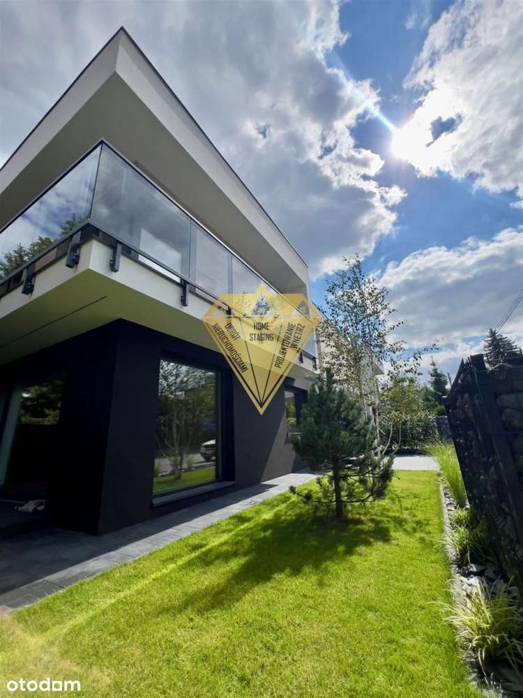 Apartament z ogrodem i 2 miejscami parkingowymi.-1