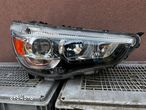 Lampa przednia MITSUBISHI ASX XENON PRAWA CZARNA EUROPA ORYGINALNA STANLEY - 1