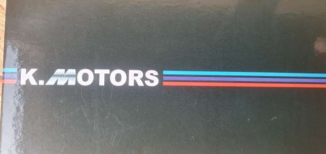 K.MOTORS logo