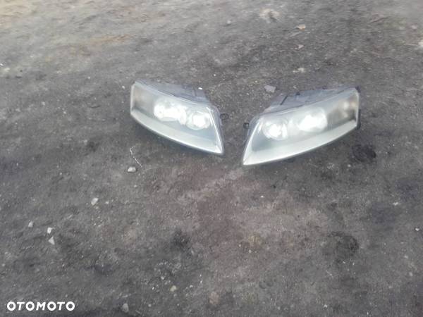 lampa przód  lewa audi a6 c6 anglik hella oryg stan bdb inne czesci a6 c6 - 1