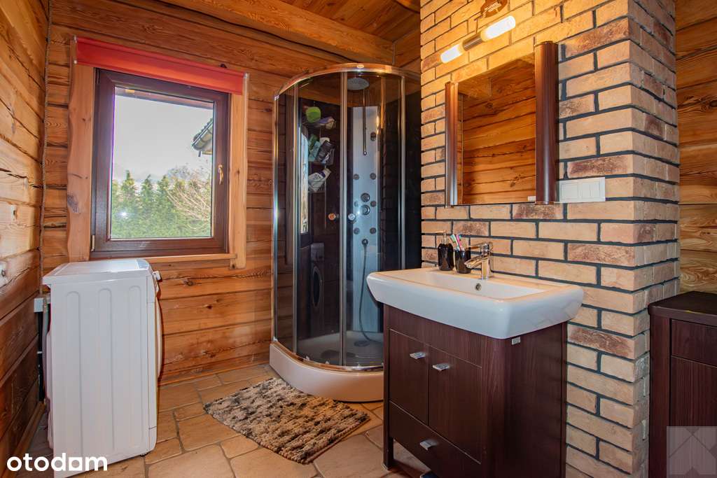 Dom z pełnego bala z zarybionym stawem-16