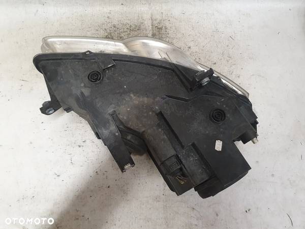 .  PRZOD PRZEDNIA LAMPA LEWA VOLKSWAGEN PASSAT B6 - 6