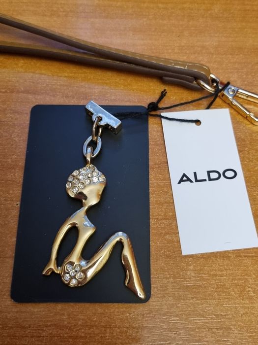 Брелок ALDO оригинал  Девушка в стразах.
Очень нарядная бижутерия!
