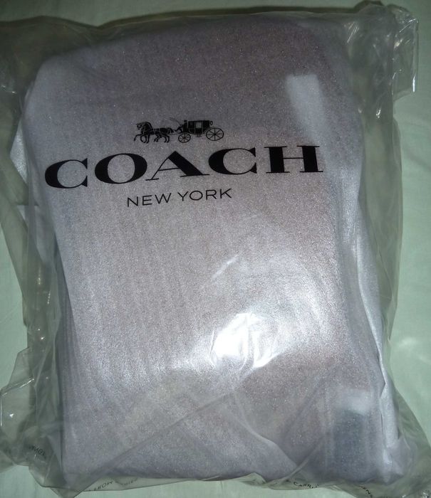 Mochila nova unissexo em pele Coach