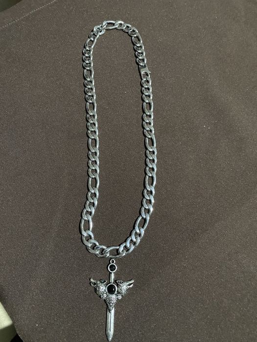 Volta em aço com Cruz