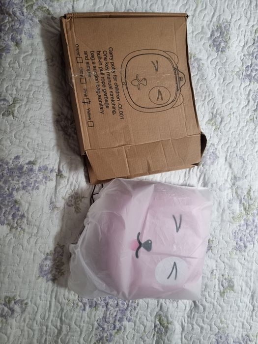 Przenośna toaleta dla dziecka, różowa z pysiem.