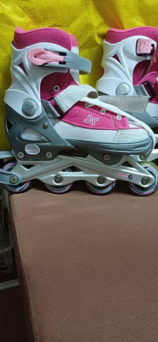 Patins em linha cor rosa