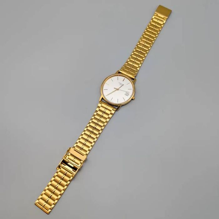Relógio Tissot em ouro 18 quilates; 54.23 gramas; 23.5cm