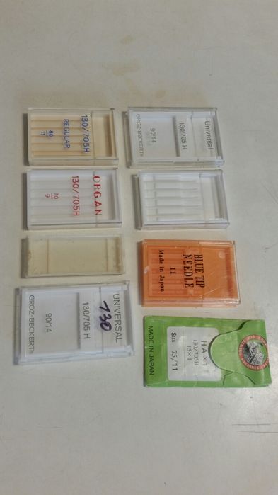 Запасные части к швейной машине лапки иголки шпульки шпульные колпачки