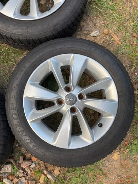 Sprzedam komplet 4 oryginalnych aluminiowych kół Opel 15" wraz z oponami zimowymi Dunlop Winter Response 2.