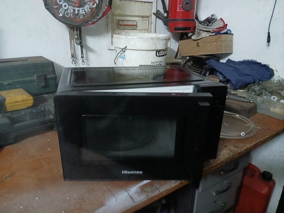 microondas no estado que se encontra-se nas fotografias