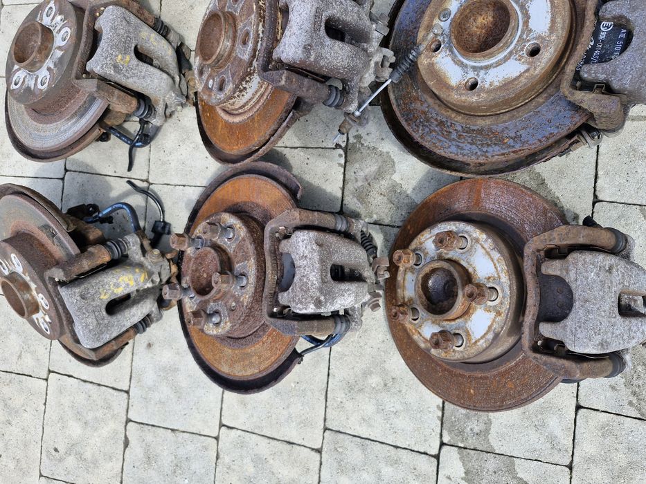 супорт задній диск тормозний Opel Astra H Zafira B