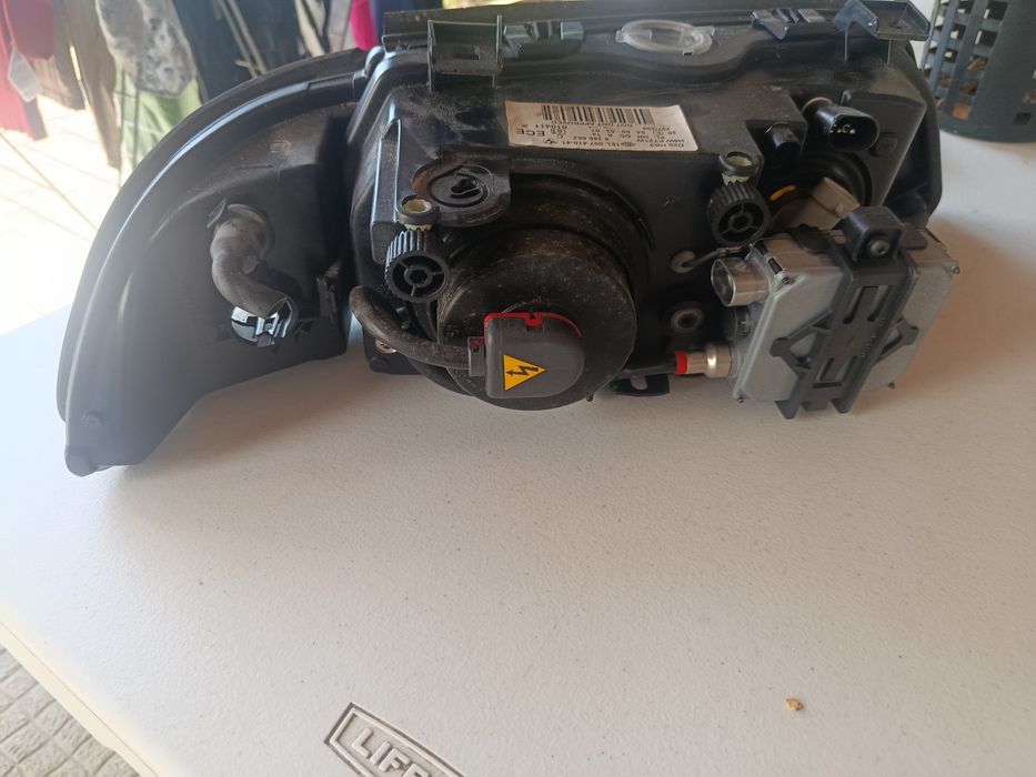 Farol BMW E39 Esq.