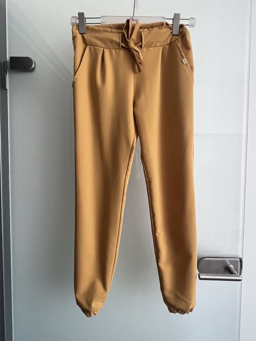 Nowe mustardowe spodnie XS