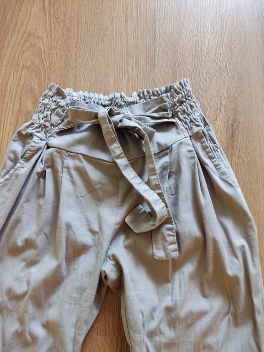 Spodnie damskie z kokardą