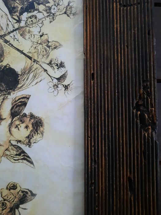 Obraz w ramce ze stuletnich bali