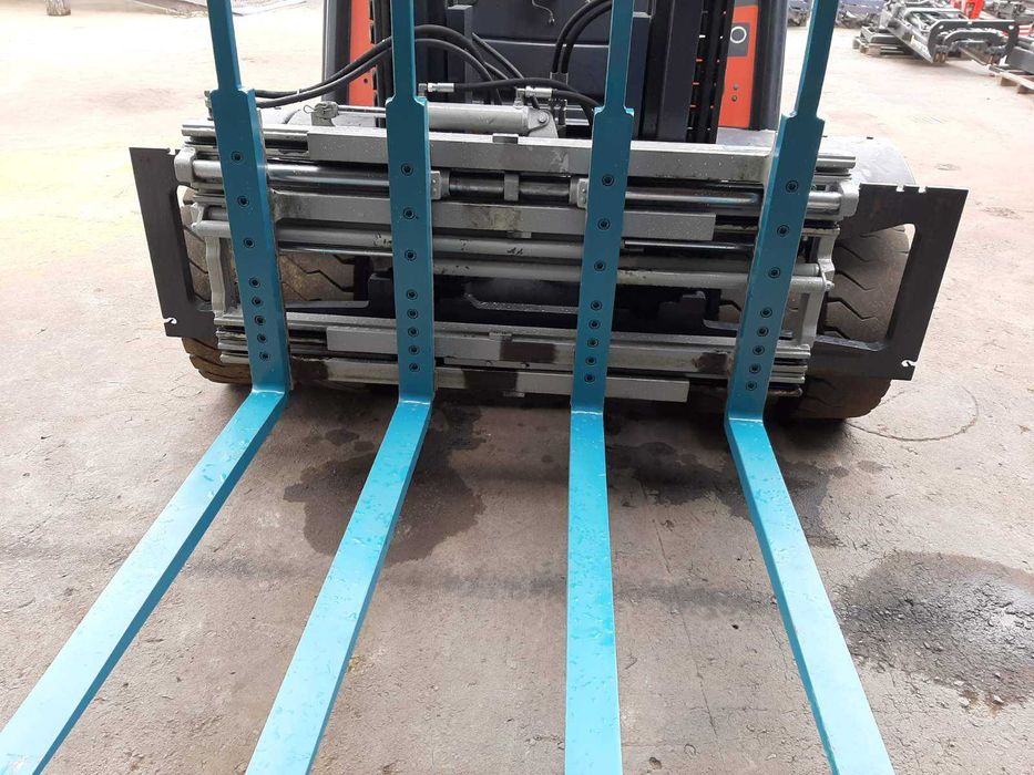 Позиціонер до навантажувача на 4 вили