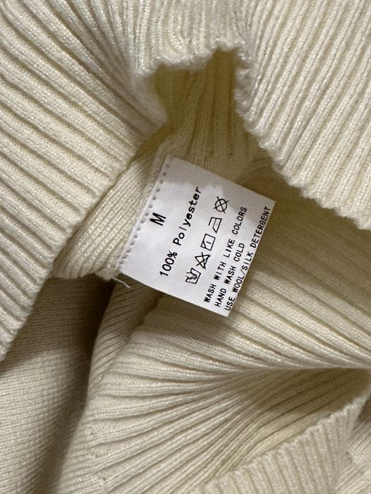 Трикотажний костюм молочного кольору з широкими брюками штанами