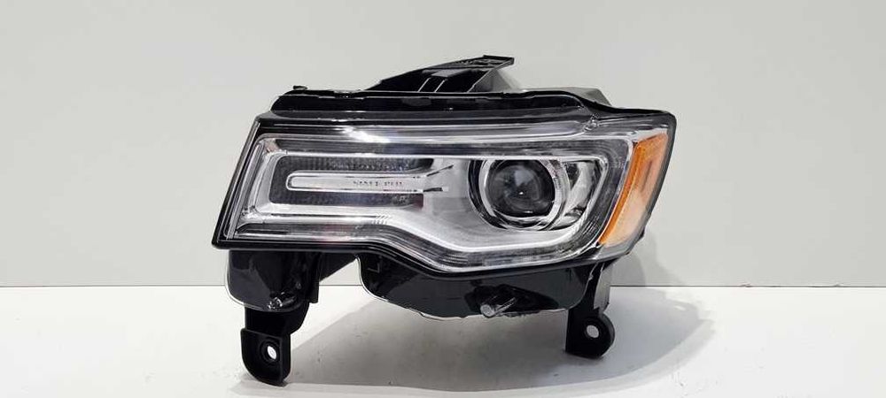 Reflektor lewy xenon Jeep Grand Cherokee WK2 USA nieskrętny