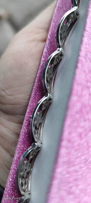 Срібні браслети з золотими вставками.