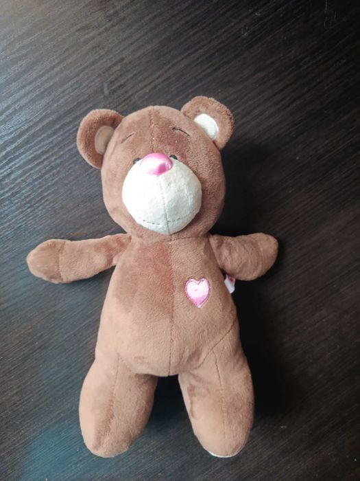 Медведик коричневий М'яка іграшка у ідеальному ствні