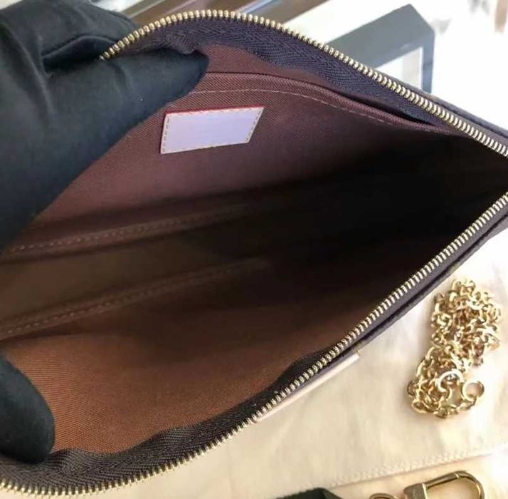 Bolsa multiacessórios Louis Vuitton