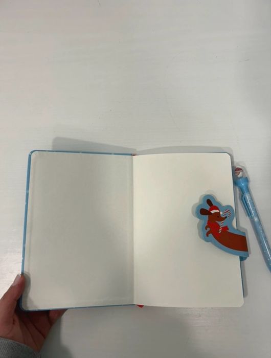 Caderno e caneta da Tiger