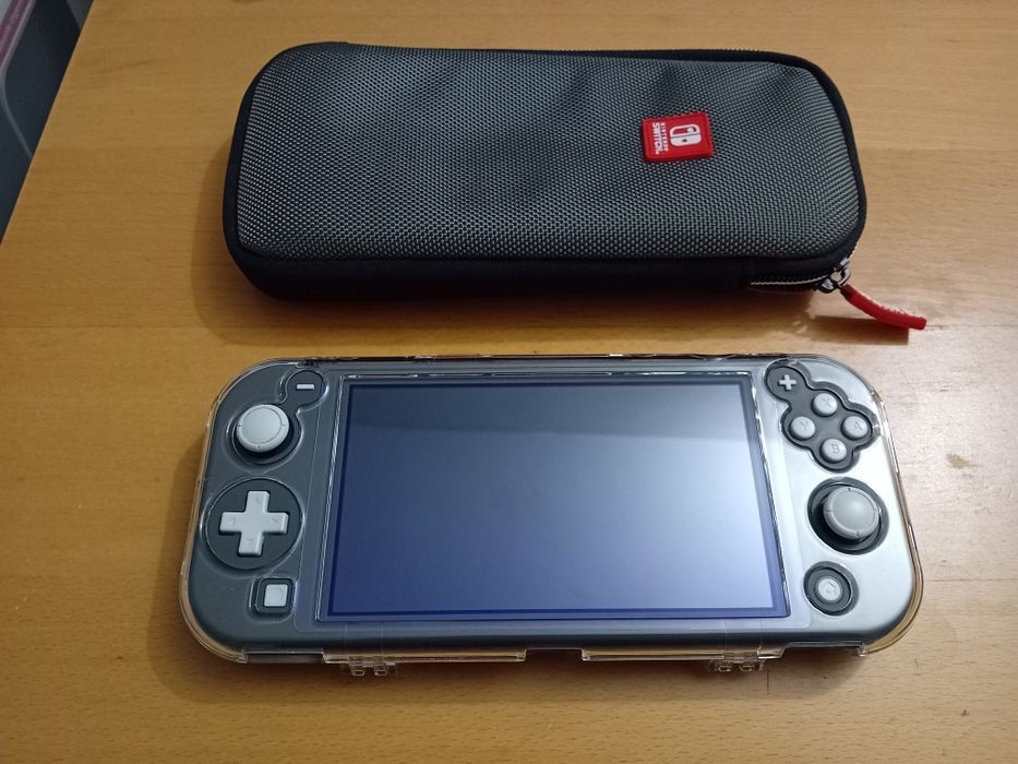 Nintendo Switch Lite + Extras