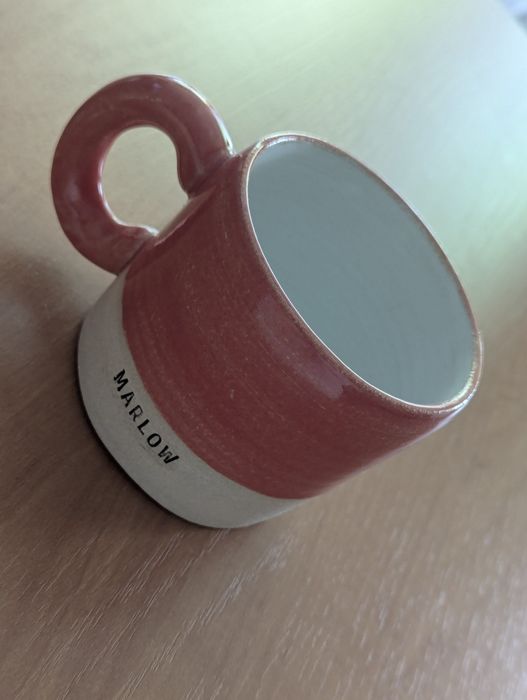 Nowy, ceramiczny kubek z uchem