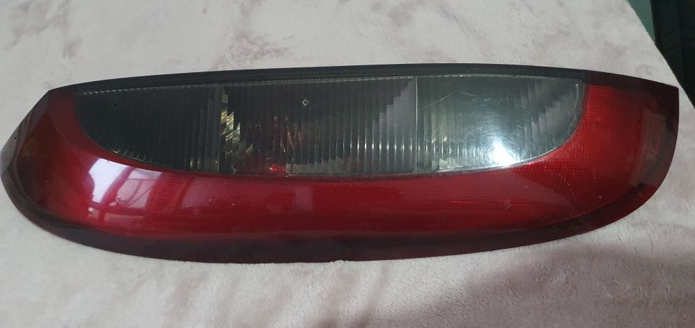 Stop esquerdo opel corsa