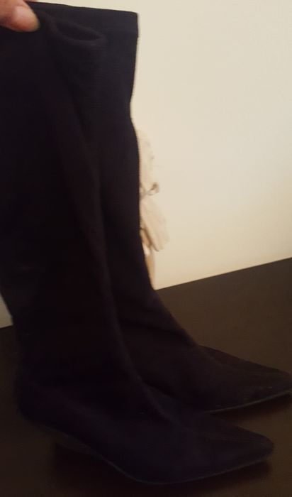 Botas pretas cano alto