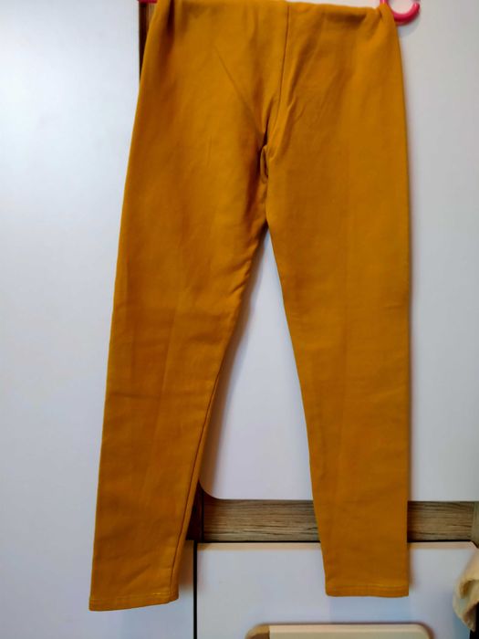 żółte spodnie z meszkiem 134 H&M