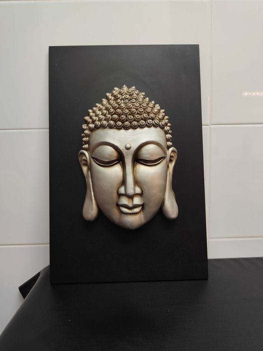 Quadros de Buda em relevo.