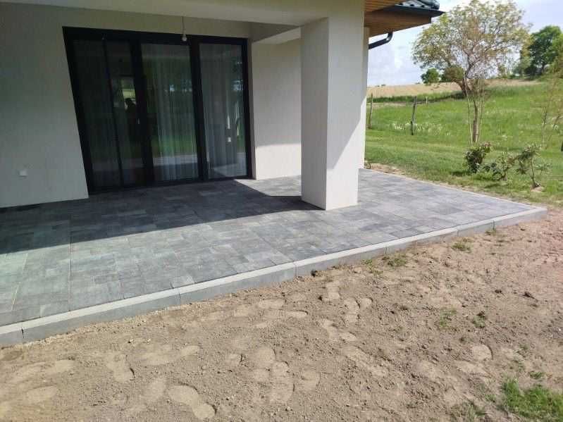 Układanie kostki brukowej. Montaż ogrodzeń